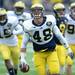 Michigan linebacker Desmond Morgan laughs after a play during spring practice at Michigan Stadium on Saturday, April 13, 2013. Melanie Maxwell I AnnArbor.com